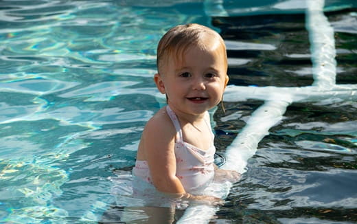 a baby in a pool