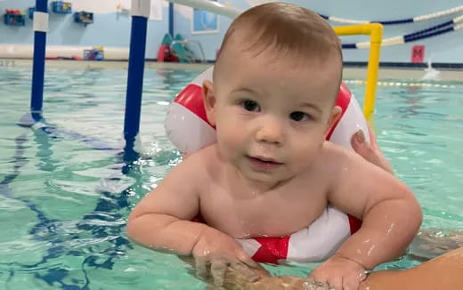 a baby in a pool