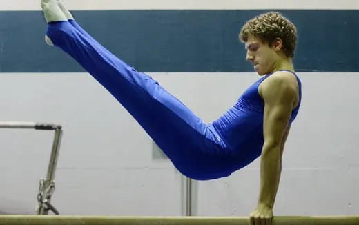 a woman doing a handstand