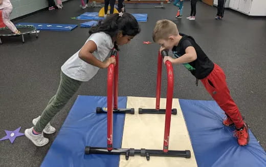 a person and a boy on a barbell
