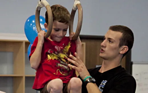 a person holding a child's head