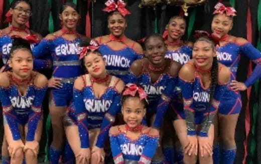 a group of girls in blue and red uniforms