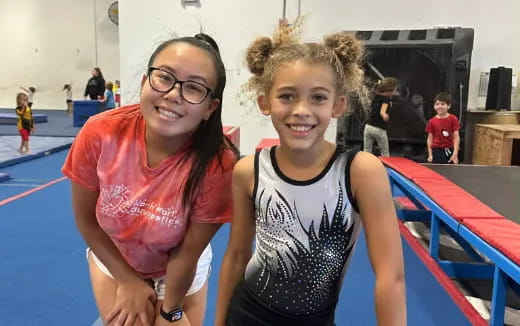 a woman and a boy posing for a picture