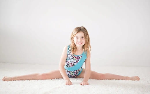 a girl sitting on the floor