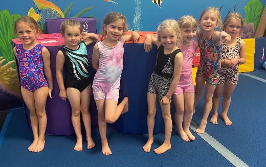 a group of girls posing for a photo