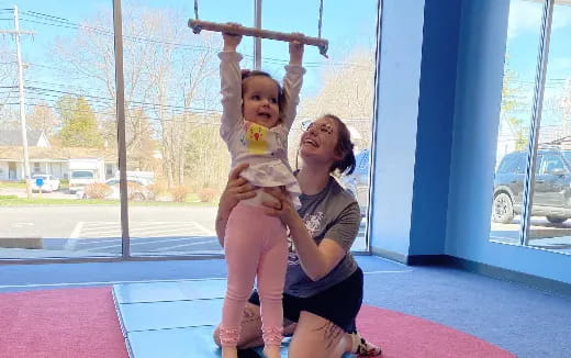 a woman holding a baby