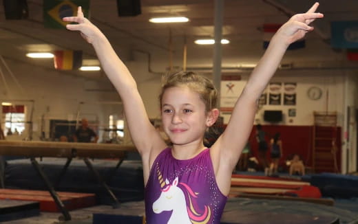 a girl with her arms up