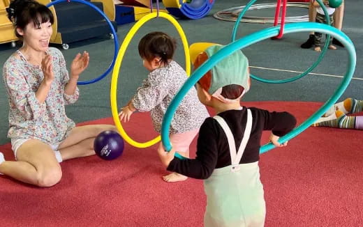 a group of children playing in a gym