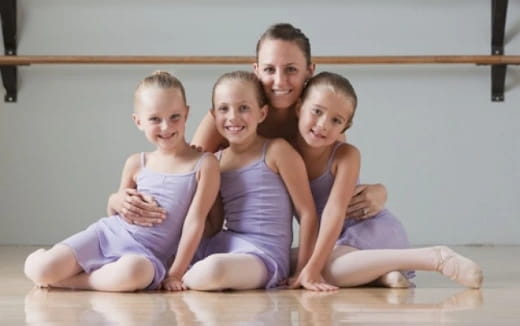 a group of children sitting on the floor