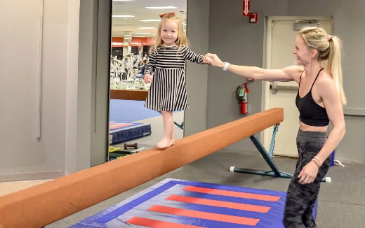 a woman standing on a mat
