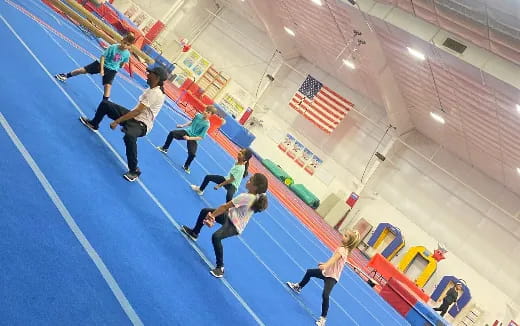 a group of people in a gym