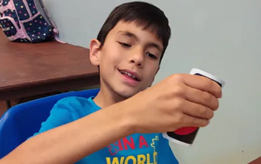 a boy holding a phone