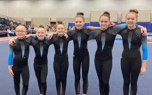 a group of people wearing black suits