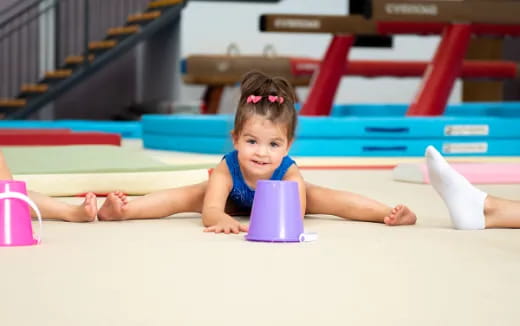 a baby lying on the floor