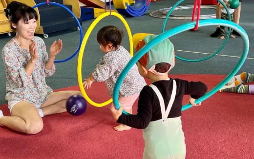 a group of children playing in a gym
