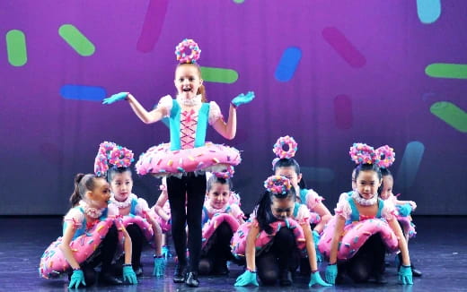 a group of children on a stage