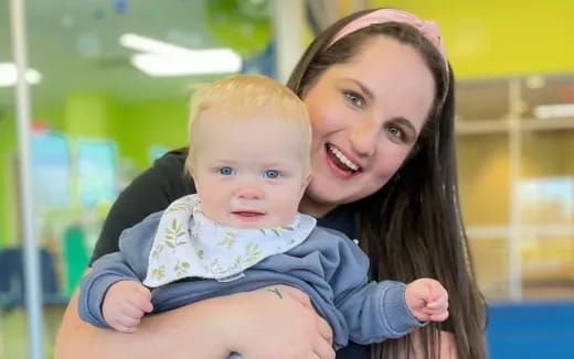 a person holding a baby