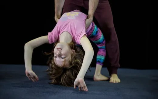 a person doing a handstand