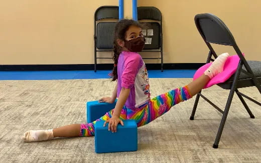 a girl sitting on the floor