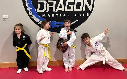 a group of children in karate uniforms