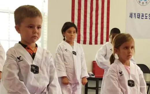 a group of people in white uniforms