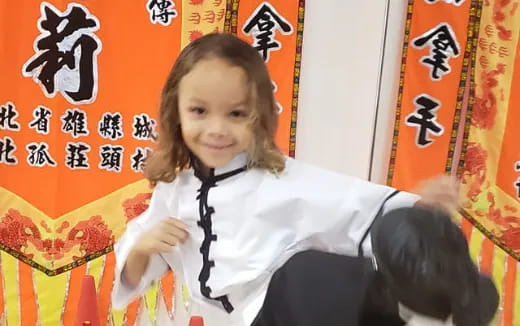 a young girl in a tie