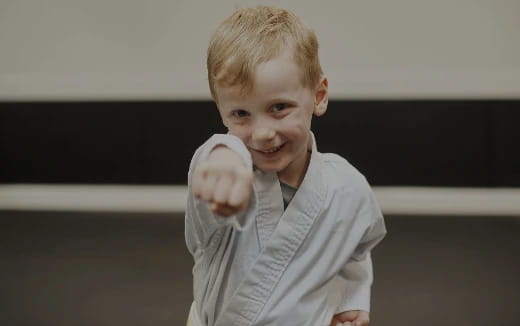 a boy holding a ball