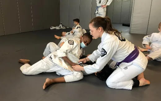 a group of people in karate uniforms