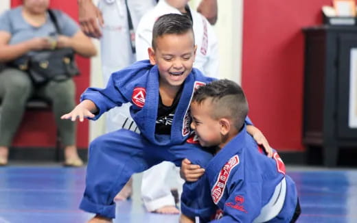 a couple of boys in blue uniforms