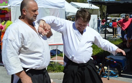 a man holding another man's hand