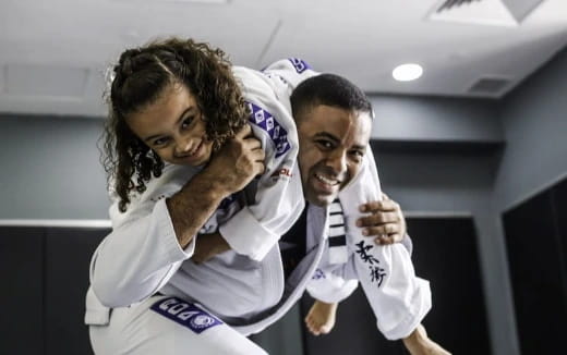 a man carrying a woman