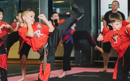 a group of kids in red uniforms