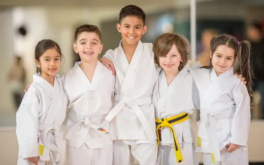 a group of children in white lab coats