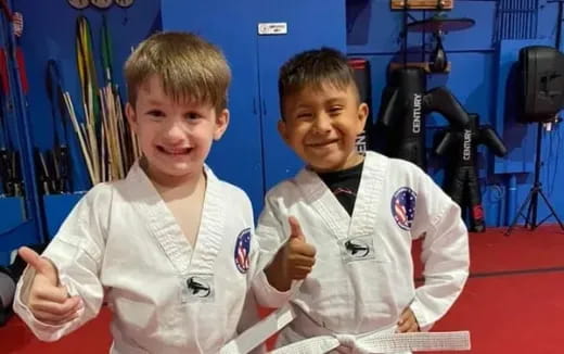 two boys in karate uniforms