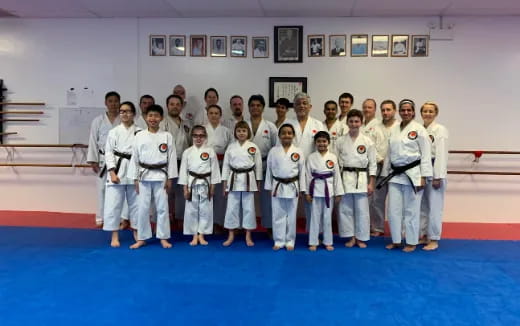 a group of people in white uniforms