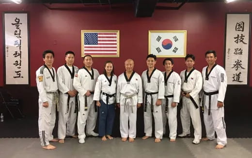 a group of people in karate uniforms