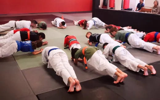 a group of people in karate uniforms