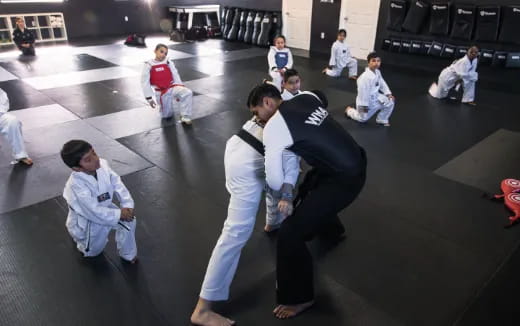 a group of people in karate uniforms
