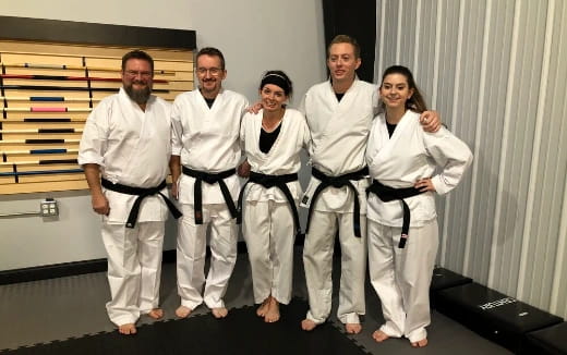 a group of people in karate uniforms