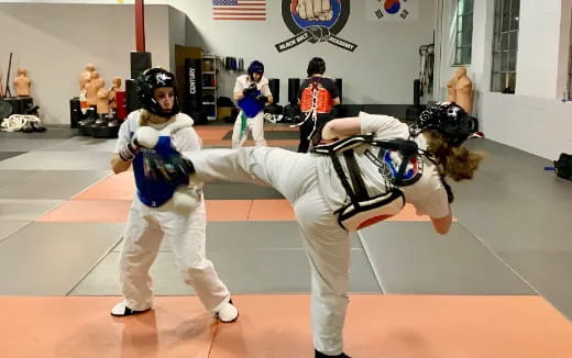 a group of people in a martial arts class