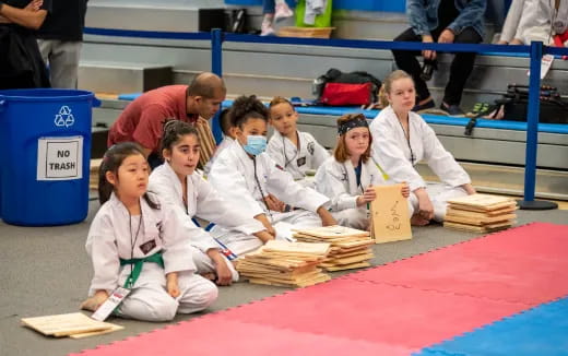 a group of people wearing white uniforms