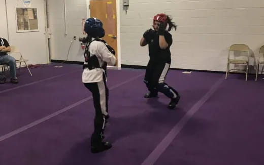 a couple of people wearing helmets and roller blades