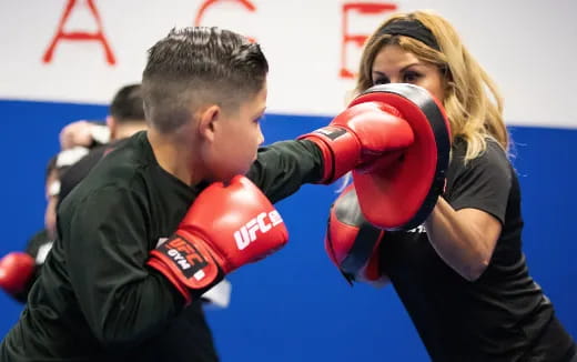 a man and woman boxing