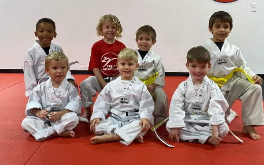a group of children sitting on the floor