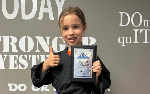 a girl holding a tablet