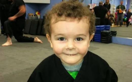 a boy with curly hair