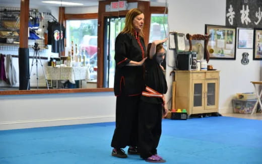 a person holding a child