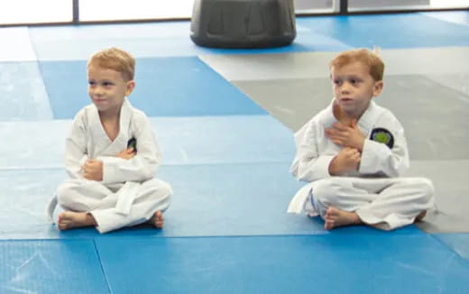 two boys in karate uniforms