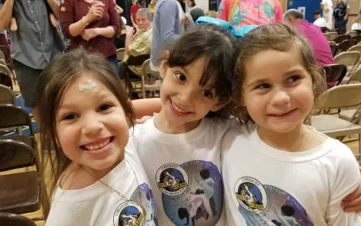 a group of girls smiling