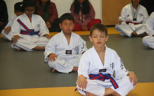a group of boys in karate uniforms